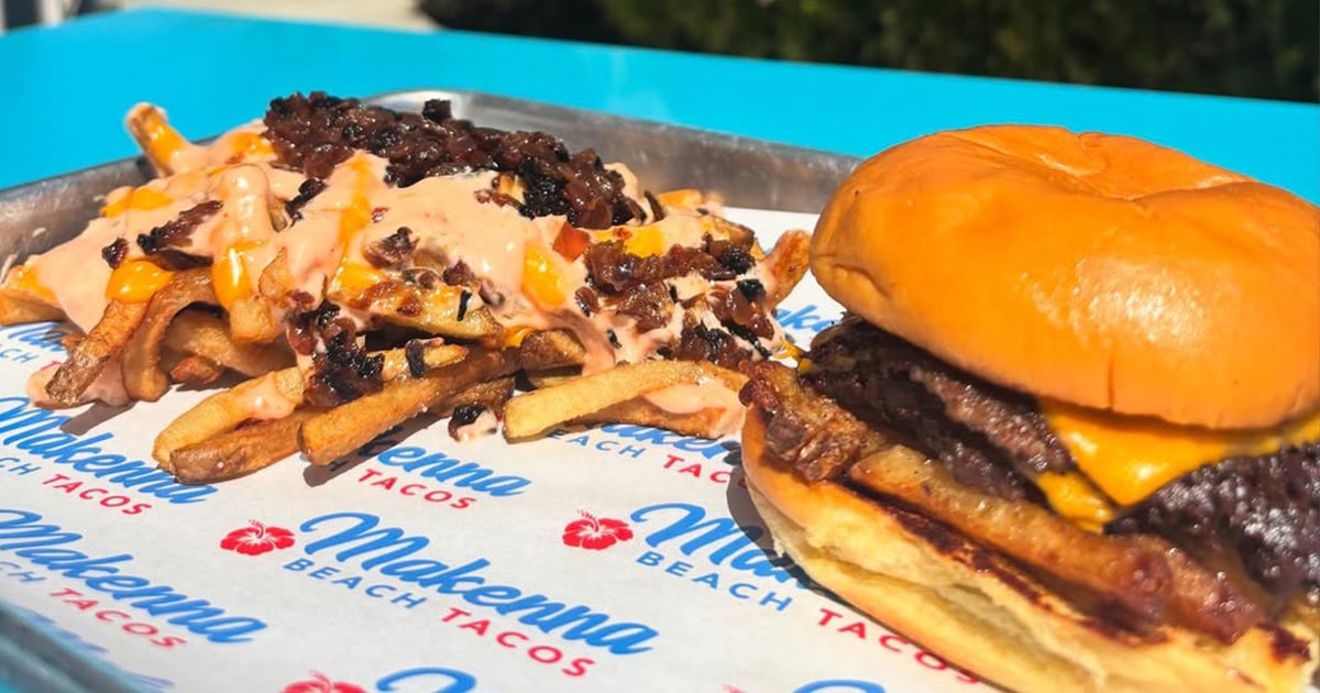 Tray with a cheeseburger featuring two beef patties and a serving of loaded fries topped with melted cheese, sauce, and crumbled beef.